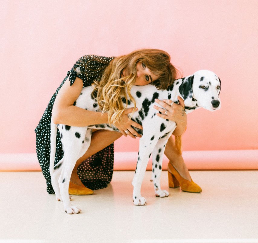 Woman hugging a dog Reactive Dog Trainers Female Partner 2